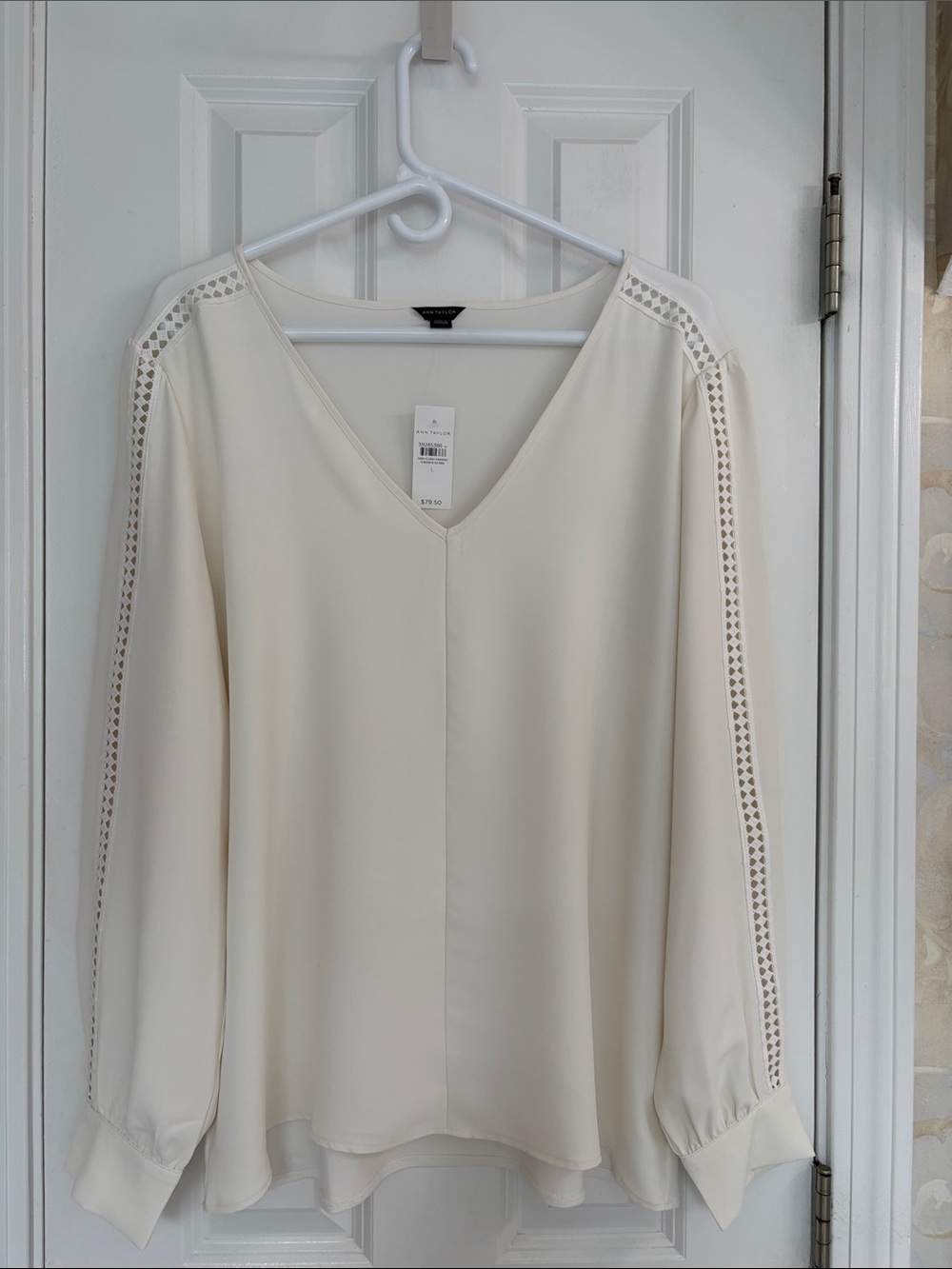 Ann Taylor Cream V-Neck Long Sleeve Blouse with Open Eyelet Trim Along Sleeve.